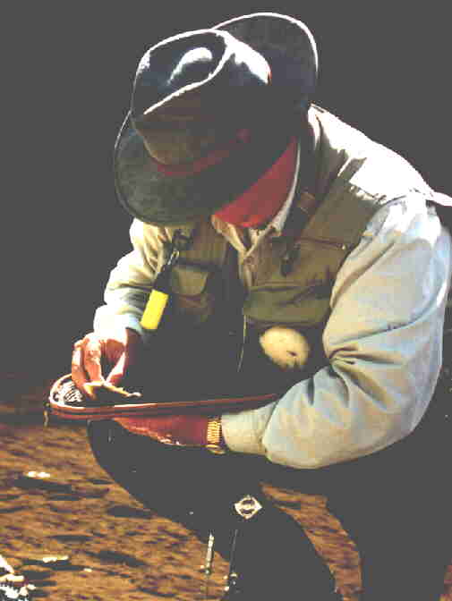 Jack Chandler unhooking that selfsame small brown trout